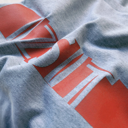 A Grey t-shirt with the phrase "Izsit" printed in Red.