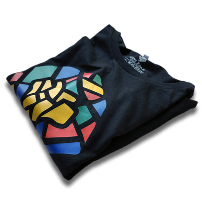 A Black t-shirt with the Lions Roam Icon printed.