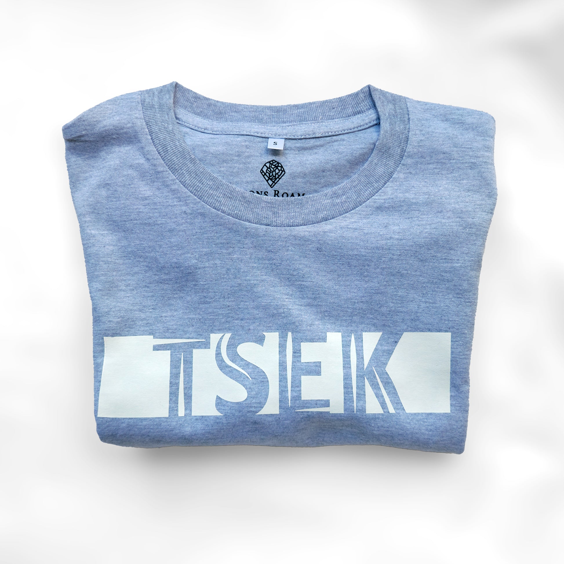 A Grey t-shirt with the phrase "Tsek" printed in White.