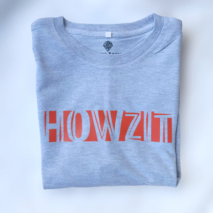 A Grey t-shirt with the phrase "Howzit" printed in Red.