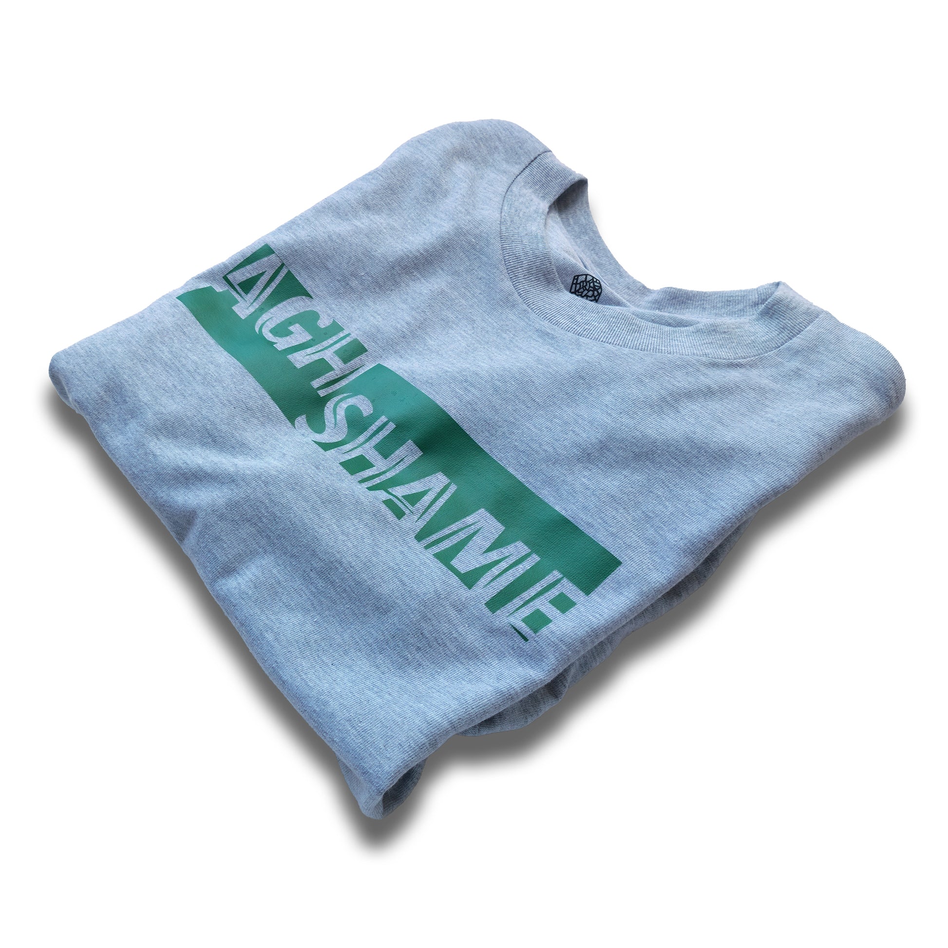 A Grey t-shirt with the phrase "Agh Shame" printed in Green.