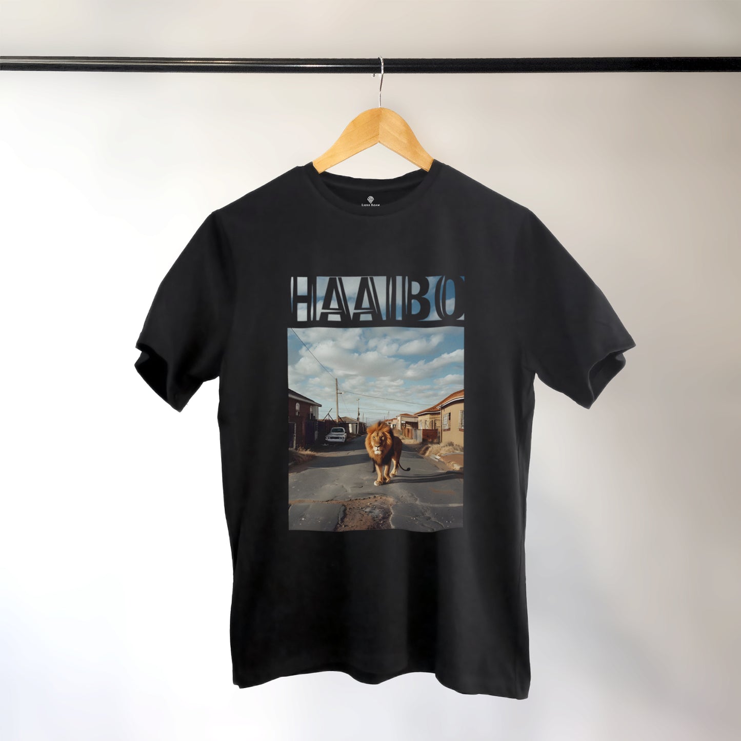 A Black t-shirt with the phrase "Haaibo" printed in the sky, with a lion roaming the streets of africa.