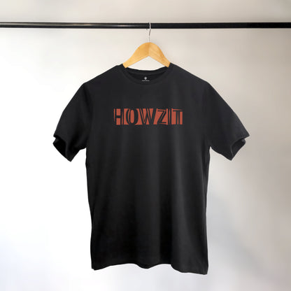 A black t-shirt with the phrase "Howzit" printed in Red.