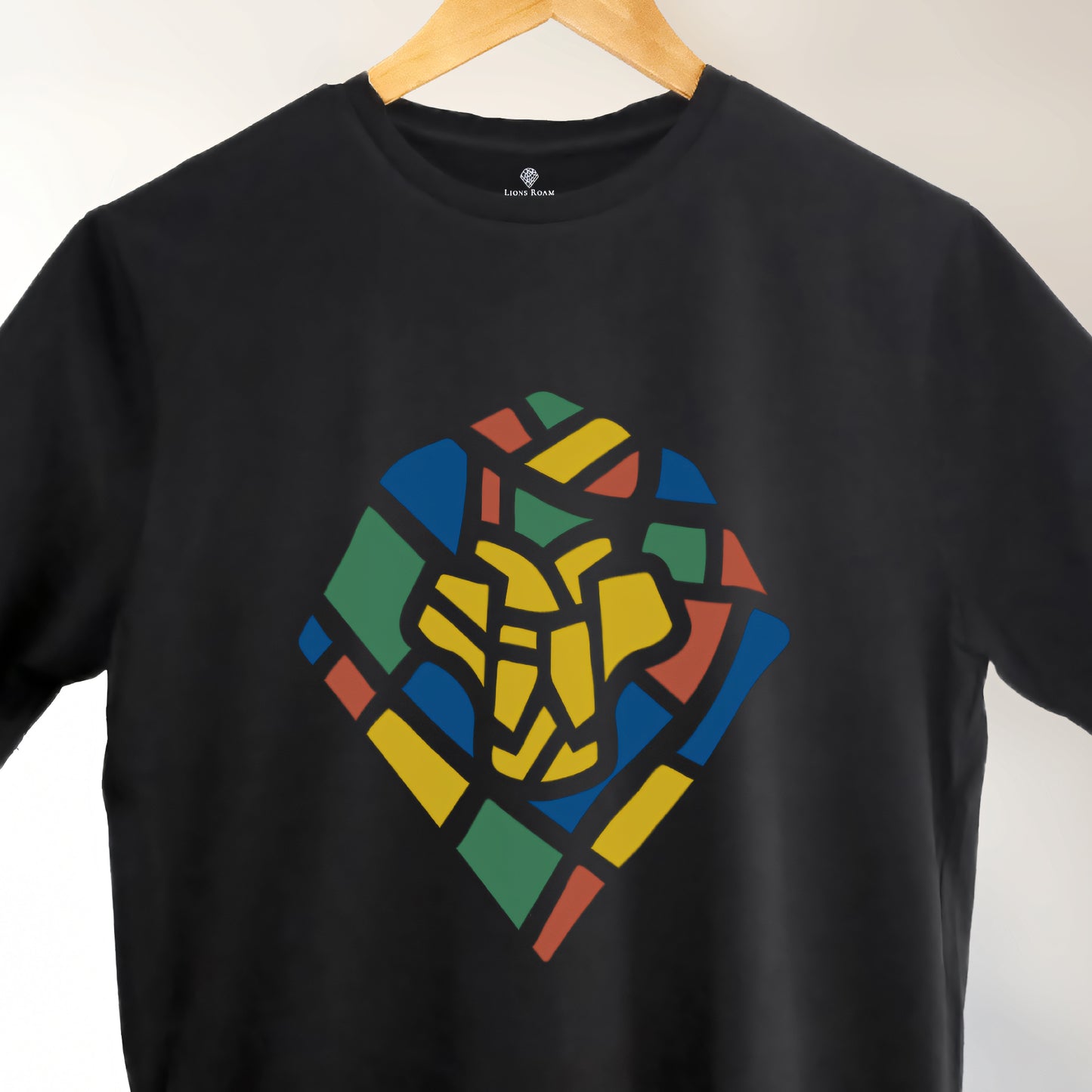 A Black t-shirt with the Lions Roam Icon printed.