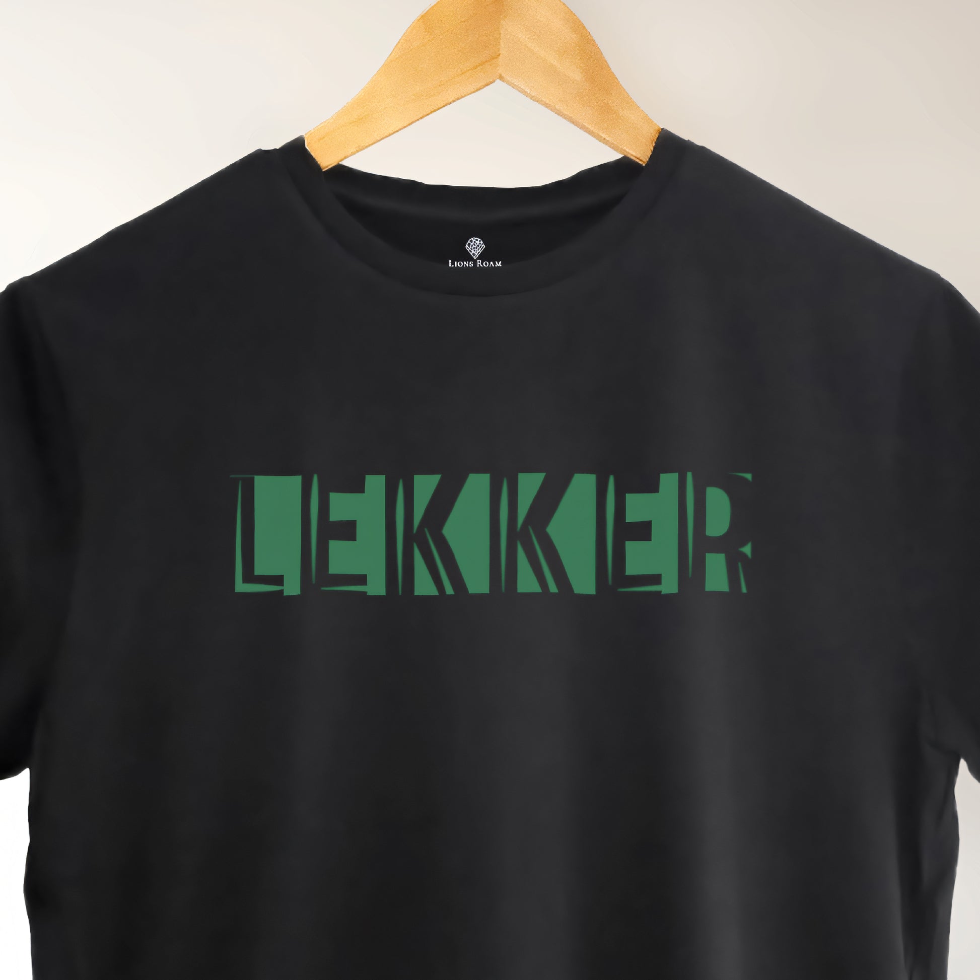 A black t-shirt with the phrase "Lekker" printed in Green.