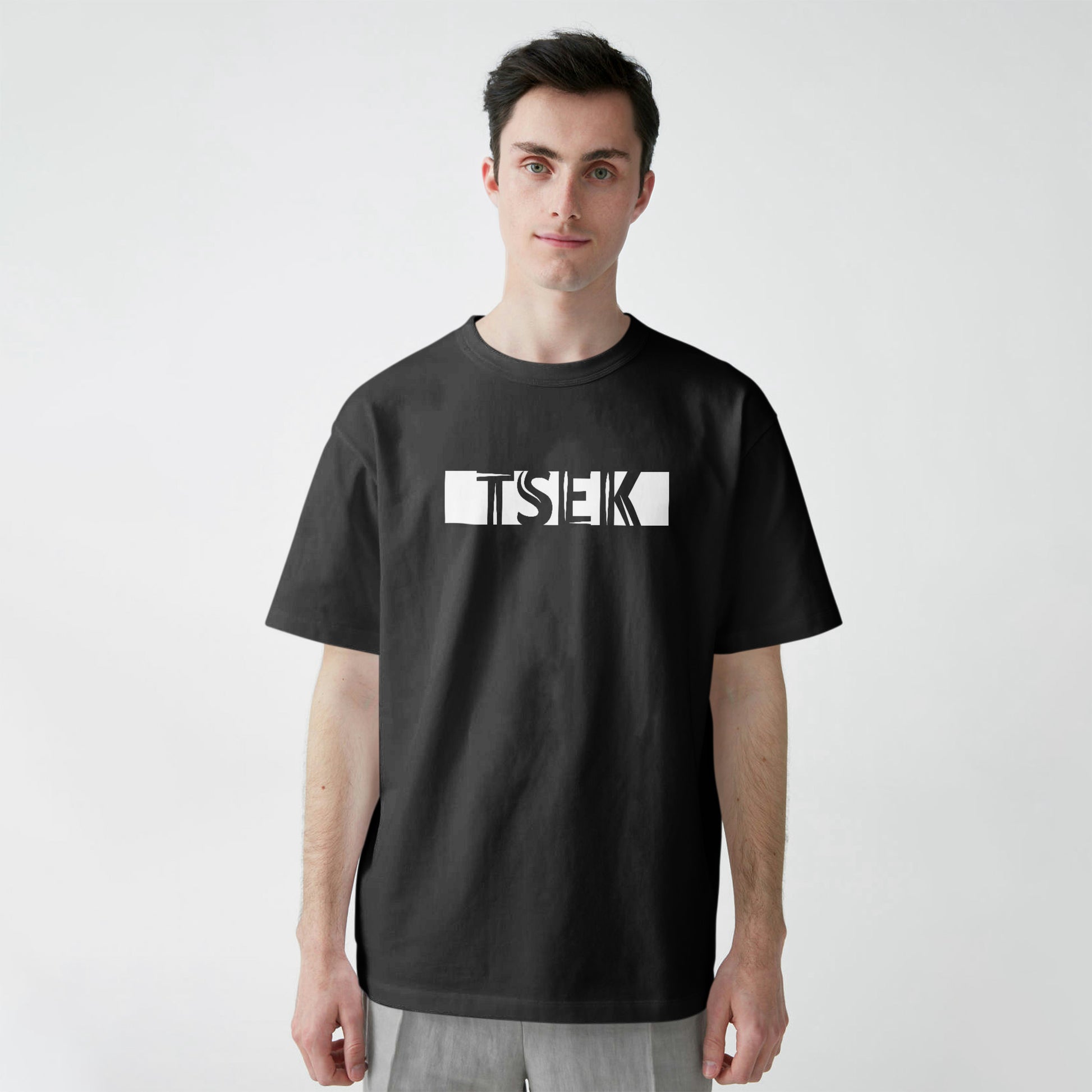 A black t-shirt with the phrase "Tsek" printed in White.