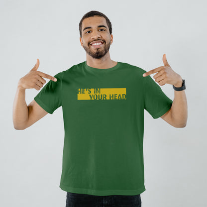 A Green t-shirt with the phrase "He's in your Head" printed in Yellow.