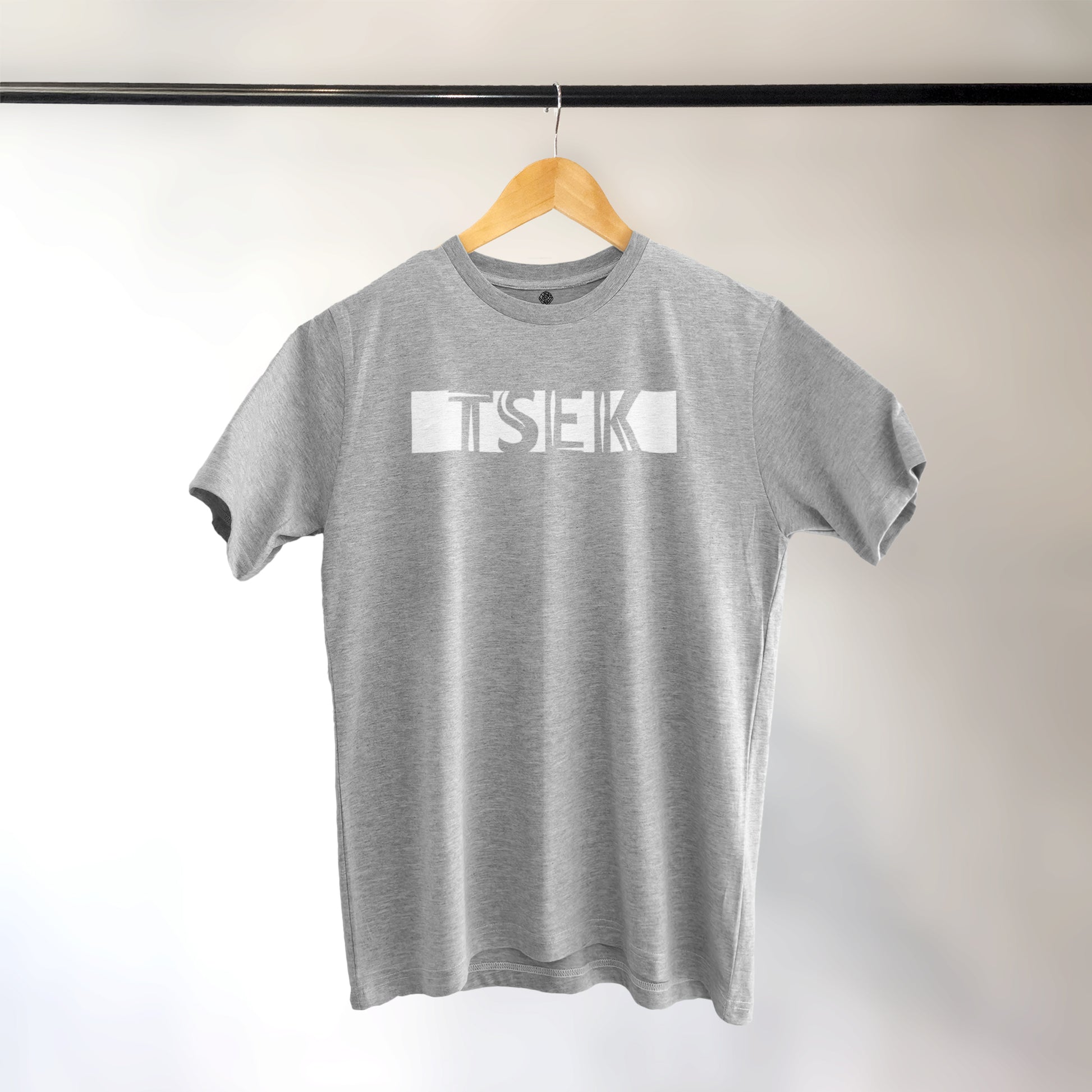 A Grey t-shirt with the phrase "Tsek" printed in White.