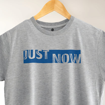 A Grey t-shirt with the phrase "Just Now" printed in Blue.