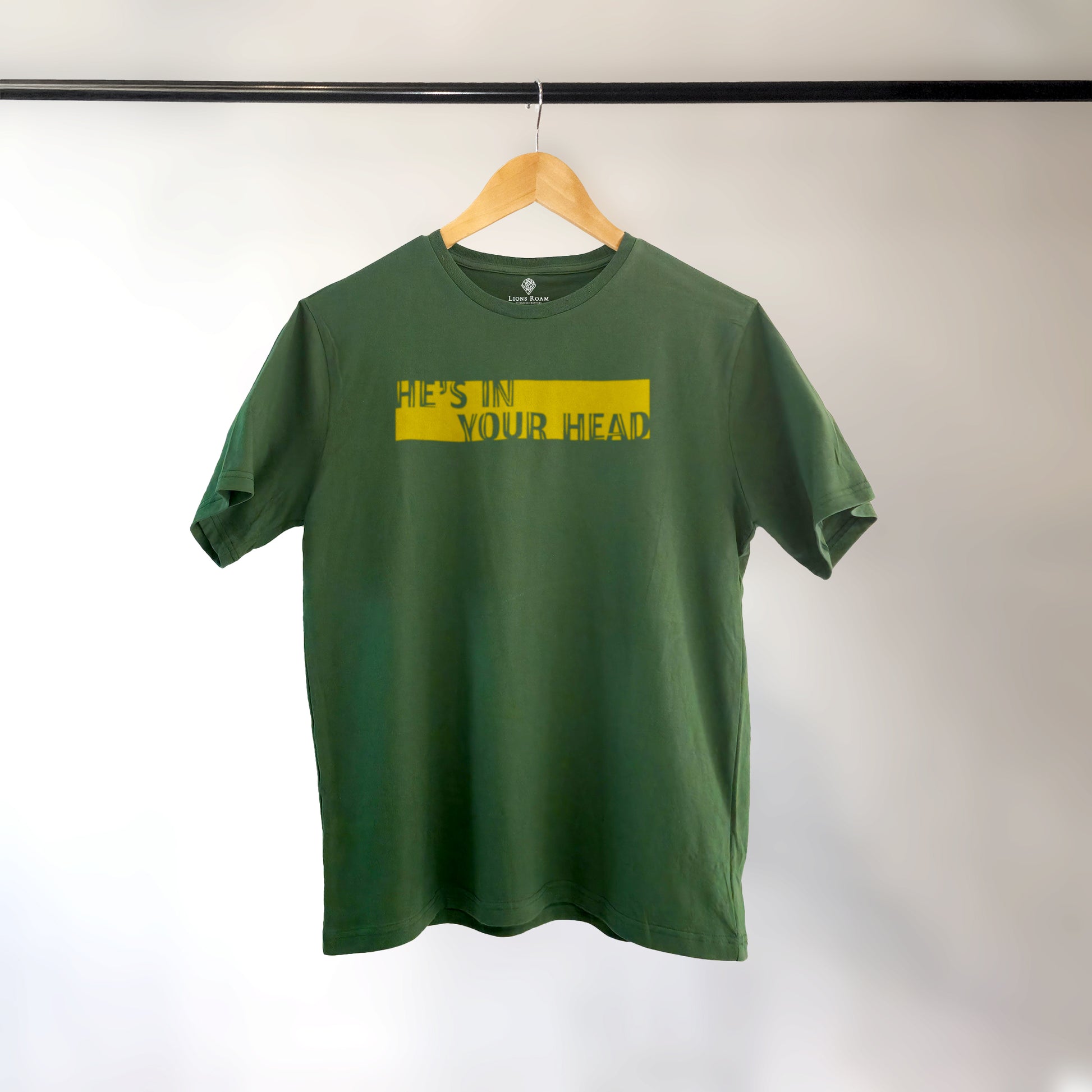 A Green t-shirt with the phrase "He's in your Head" printed in Yellow.
