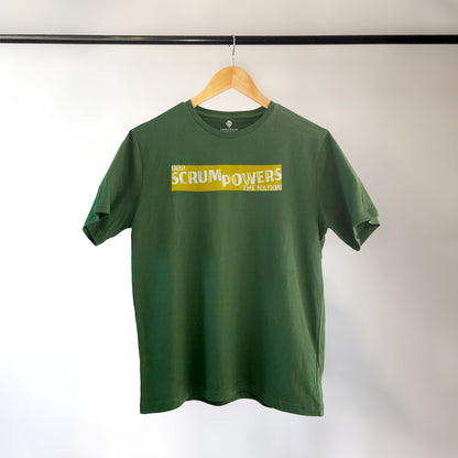 Green Lions Roam t-shirt with the phrase 'Our Scrum Powers the Nation' displayed on a hanger against a neutral background. The bold design makes a witty reference to South African resilience and rugby pride.