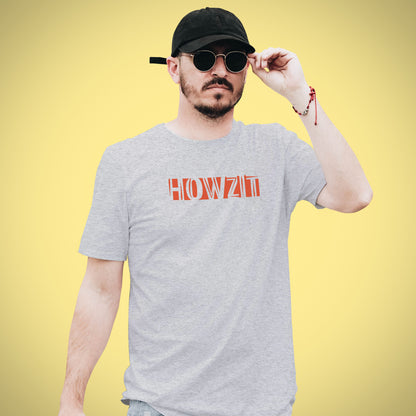 A Grey t-shirt with the phrase "Howzit" printed in Red.