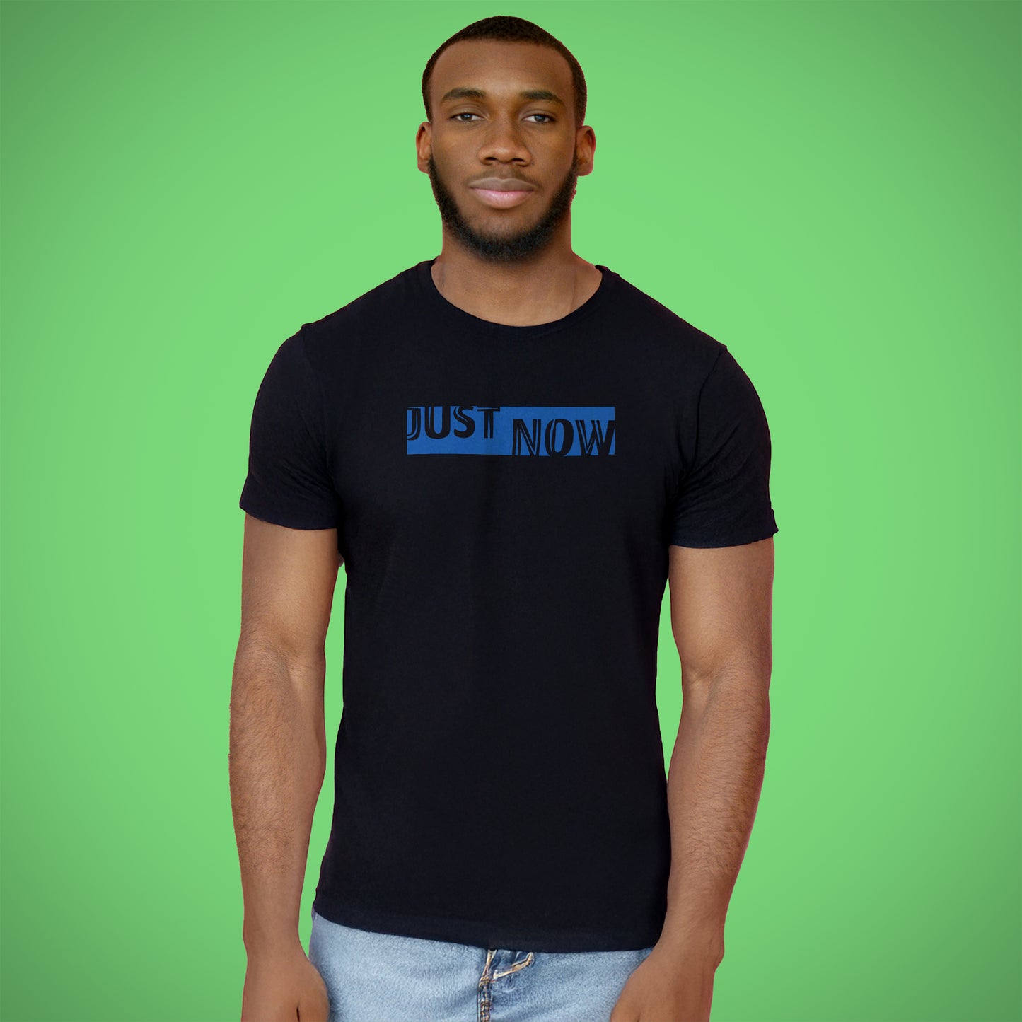 A black t-shirt with the phrase "Just Now" printed in Blue.
