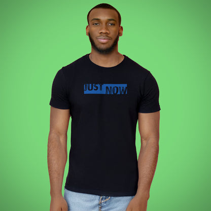 A black t-shirt with the phrase "Just Now" printed in Blue.